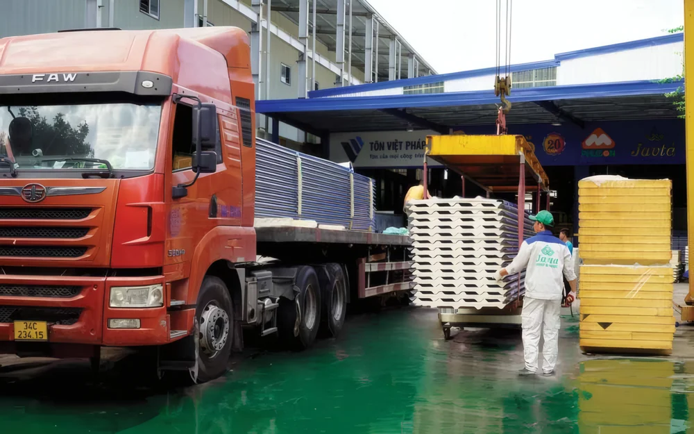 Loading roofing and panels onto a truck