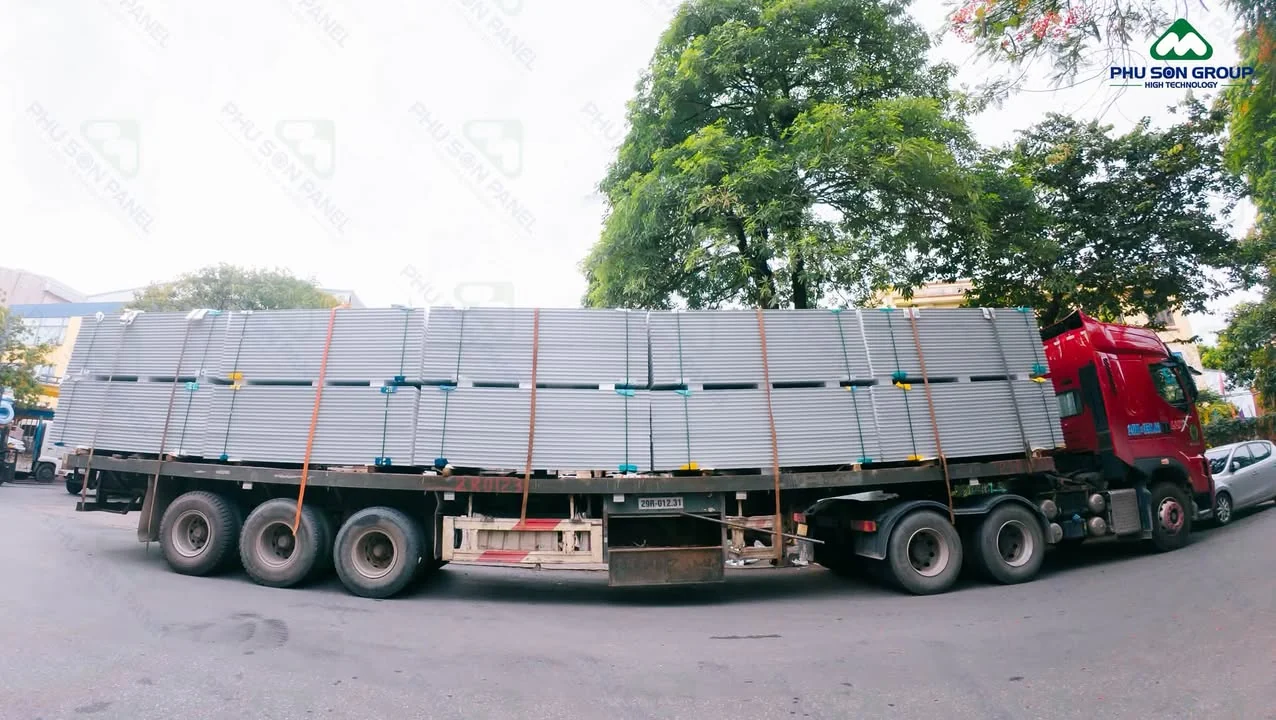 Phu Son workers loading panels into a container for shipment